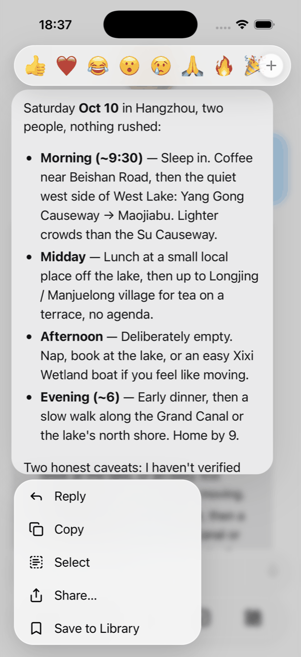 Long-press menu on a reply with reactions, Reply, Copy, Select, Share and Save to Library